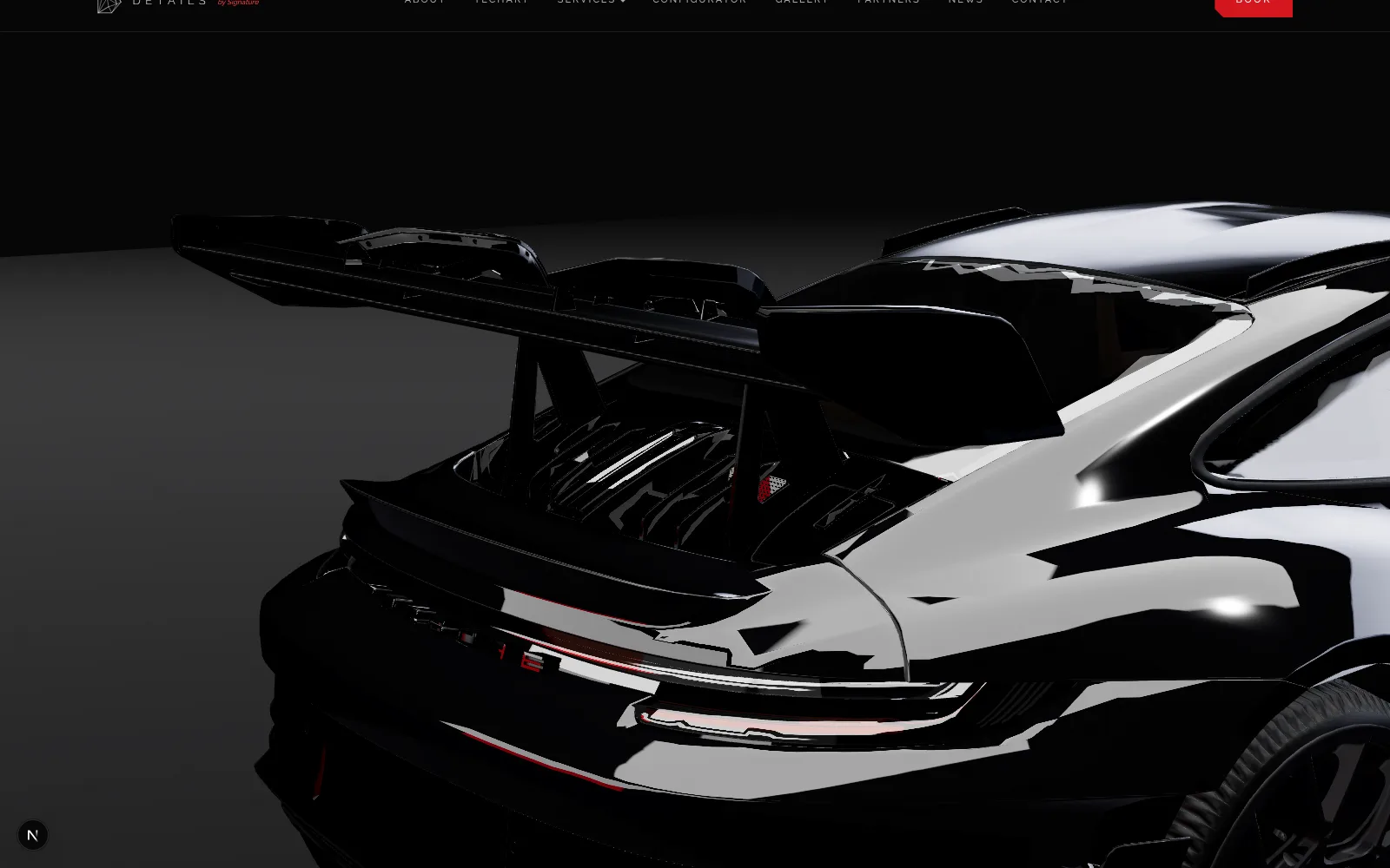 The rear wing and engine cover of a 911, rendered in black