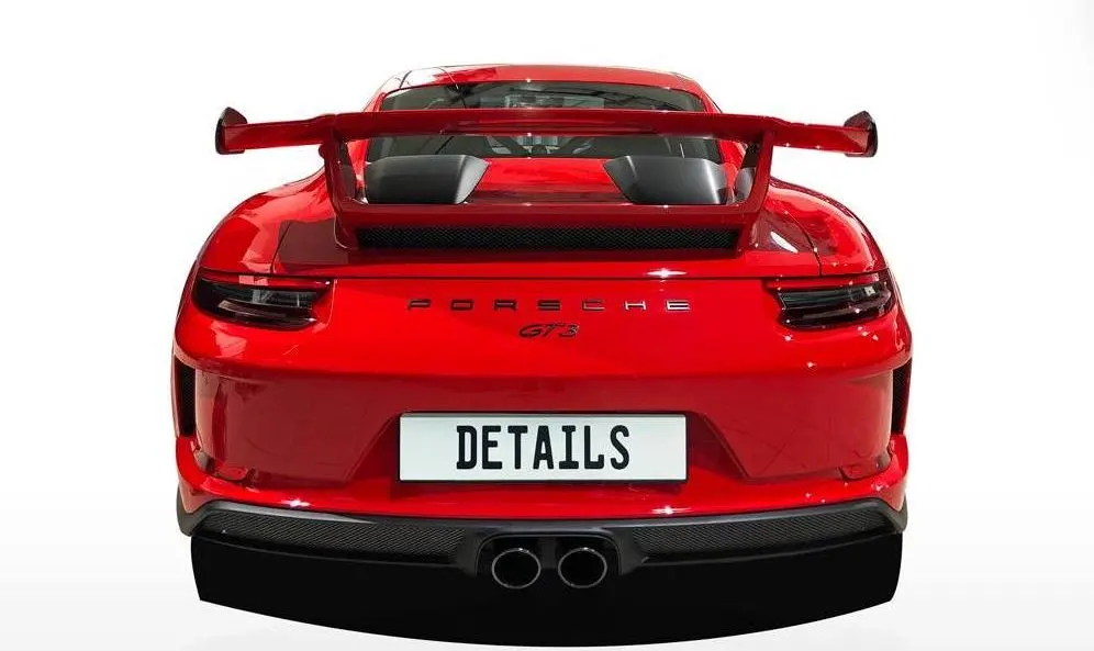 The rear of a red Porsche 911 GT3 with a number plate reading DETAILS