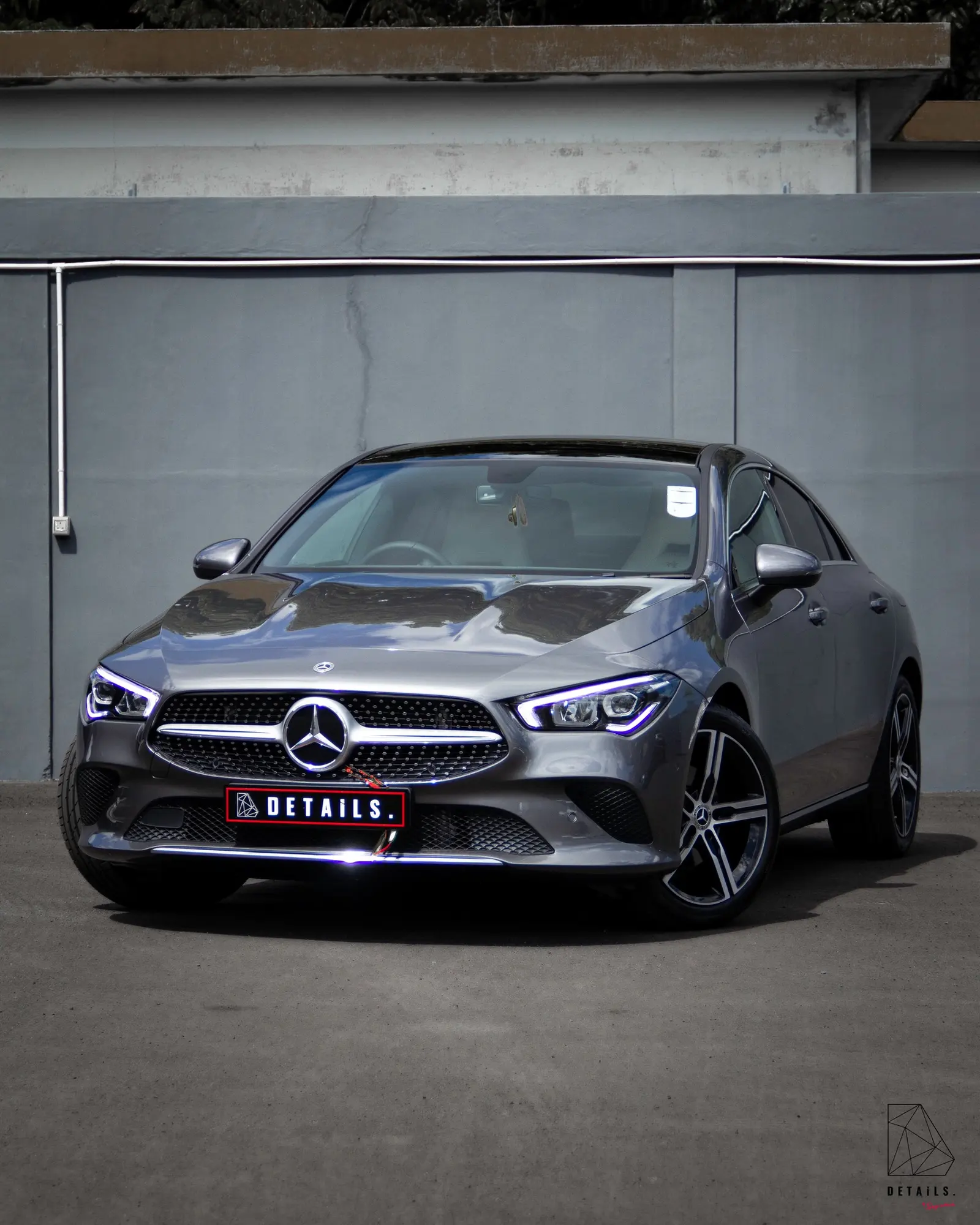 A silver Mercedes-Benz CLA with a DETAILS number plate